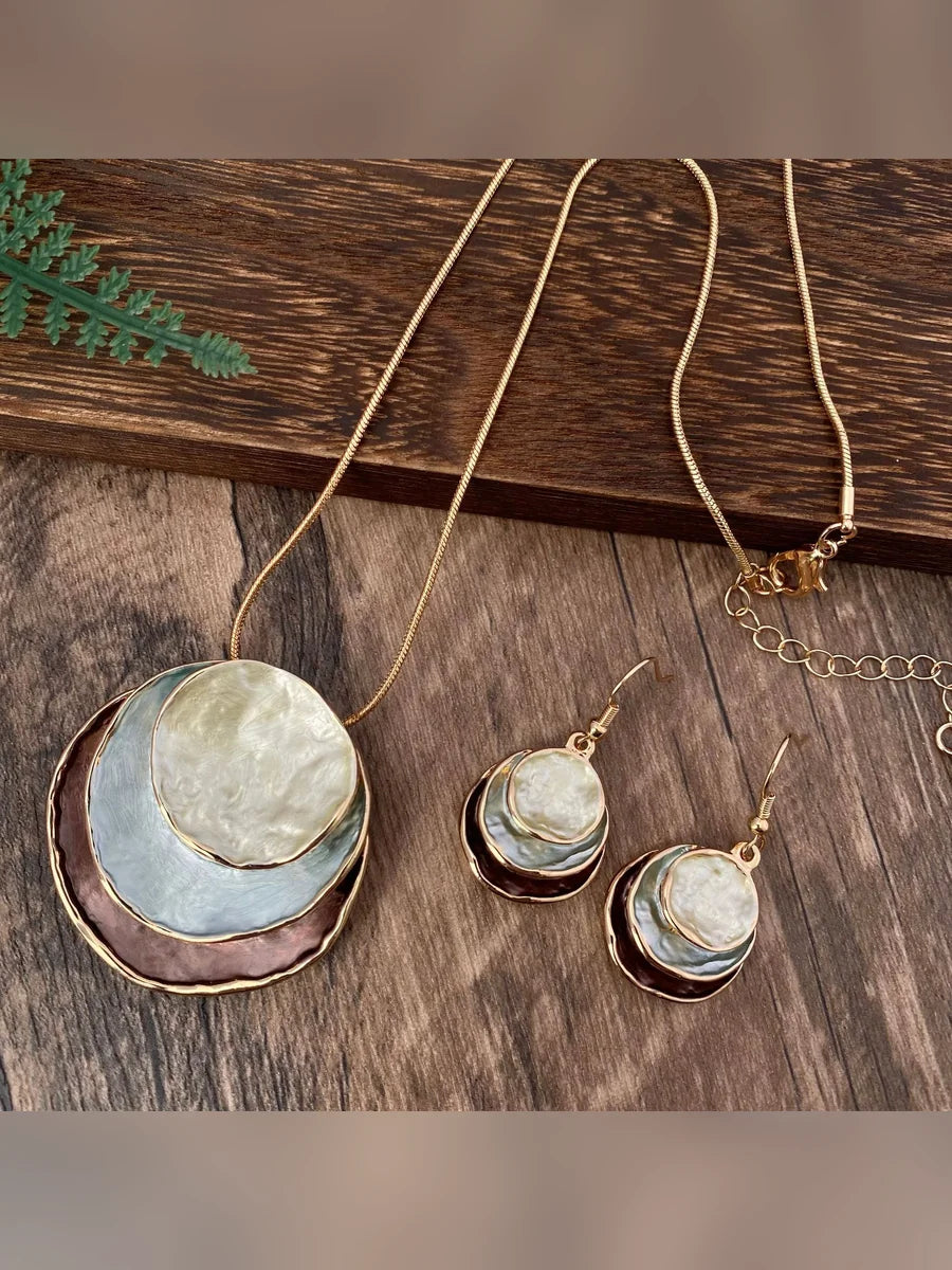 Set de collar y aretes esmaltados en marrón y gris azulado