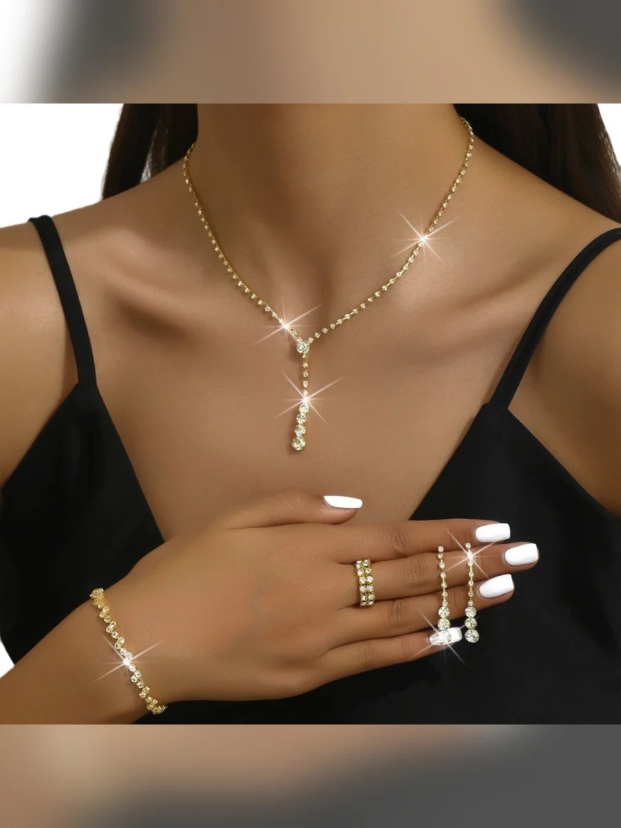 Set de cristales dorado con collar en Y, aretes, pulsera y anillo