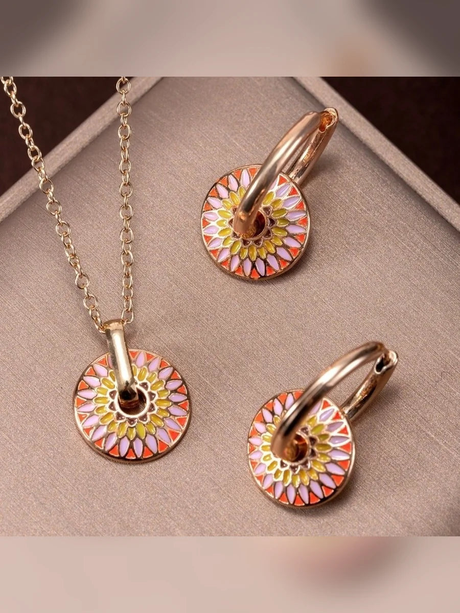 Set de collar y aretes con disco de colores en tonos rosa y naranja