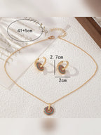 Medidas del collar de 41 cm más 5 cm de extensión y de los aretes de 2,7 por 2 cm