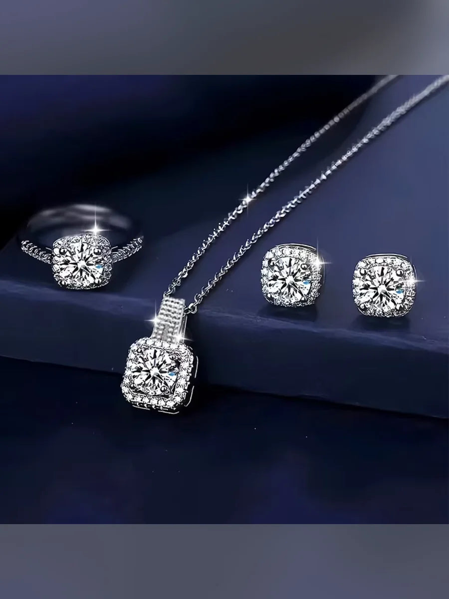 Anillo, aretes y collar con dije cuadrado de circonia sobre base azul