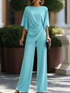 Conjunto de blusa drapeada y pantalón ancho en color turquesa, vista frontal